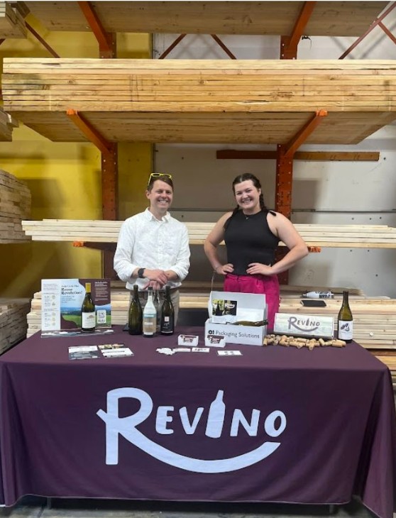 Adam and Abby tabling at a event for Revino