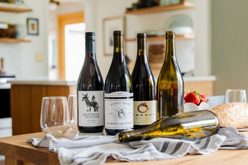 A lineup of Revino partnered labels in the standardized Revino bottles.